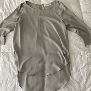 pants store light grey shirt